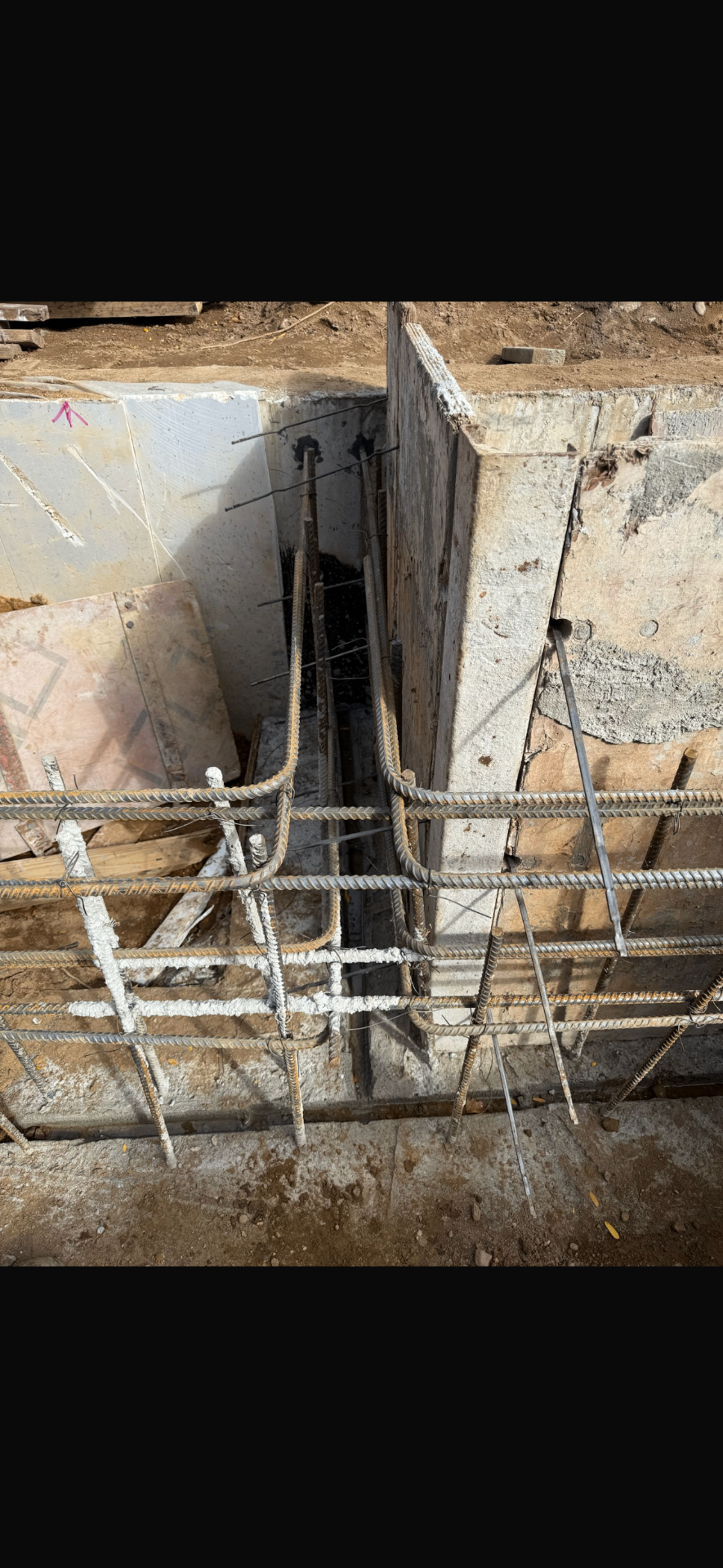 Rebar cage and reinforcement tied at an AGC foundation wall and footing